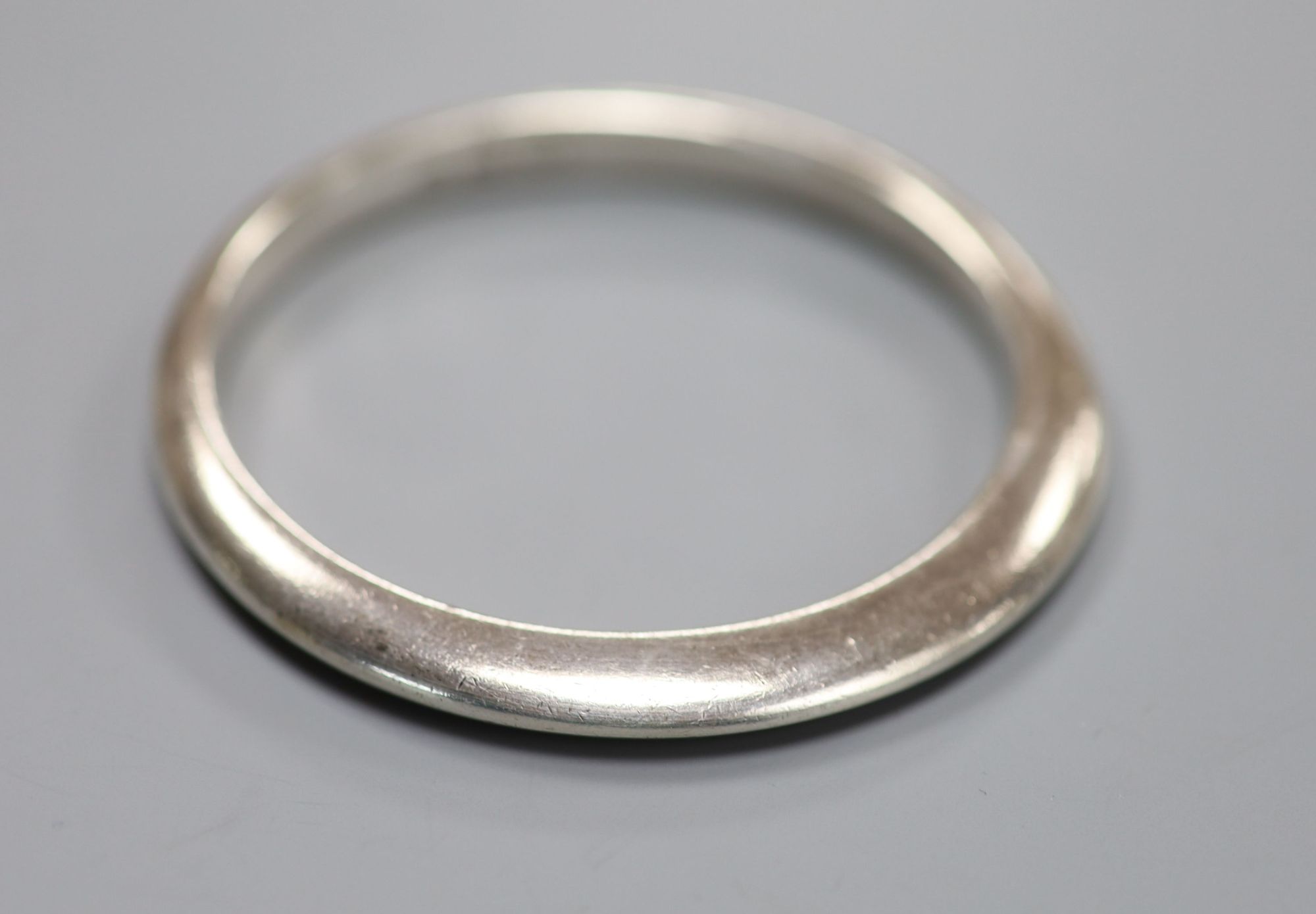 An early 1970s Georg Jensen sterling bangle design no. 168, 75.9 grams, import marks for London, 1970.